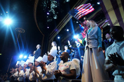 Norwegian Gem Staff gather on stage Stardust Theater.jpg
