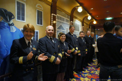 Norwegian Gem Senior Officers greet guests leaving theater.jpg