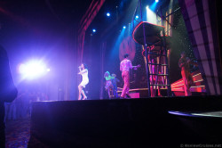 Cruise Director Julie speaks on stage aboard Norwegian Gem.jpg