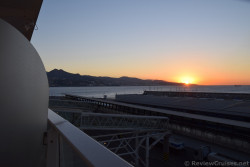 Sunrise over Malaga seen from the Port.jpg